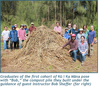 Graduates of the first cohort of Ku I Ka Mana pose with 'Bob,' the compost pile they built under the guidance of guest instructor Bob Shaffer (far right)