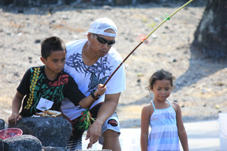 Dayhtan Barawis drops his line into Waikua‘a‘ala Pond in Kahalu‘u Bay Education Center’s first-ever Keiki Fishing Derby. He went on to win prizes for Most Fish Caught and Biggest Fish Caught in the Boys 7-10 division.