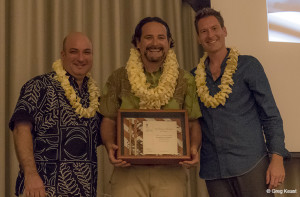 Dr. Kamanamaikalani Beamer (center) is joined by Ron Cox (left), director of Kamehameha Publishing, and David Deluca, president of the Hawai‘i Book Publishing Association, as he receives the 2015 Samuel M. Kamakau Book of the Year Award. (Photo courtesy Greg Keast)