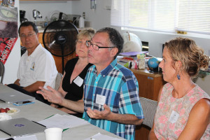 Chris Hecht, executive director of Kona Pacific Public Charter School, explains how a co-op could procure locally grown food for school meals, reduce costs, and streamline administrative functions at a Charter School Food Working Group meeting held June 30, 2015 in Pāhoa. 