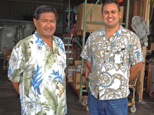 The Food Basket's Marshall Akamu (left), operations manager for North and West Hawai‘i, and executive director En Young at the organization’s warehouse in Kailua-Kona. (Photo courtesy The Food Basket)